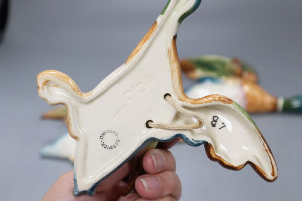 Three Beswick Mallard duck wall plaques, largest 22cm